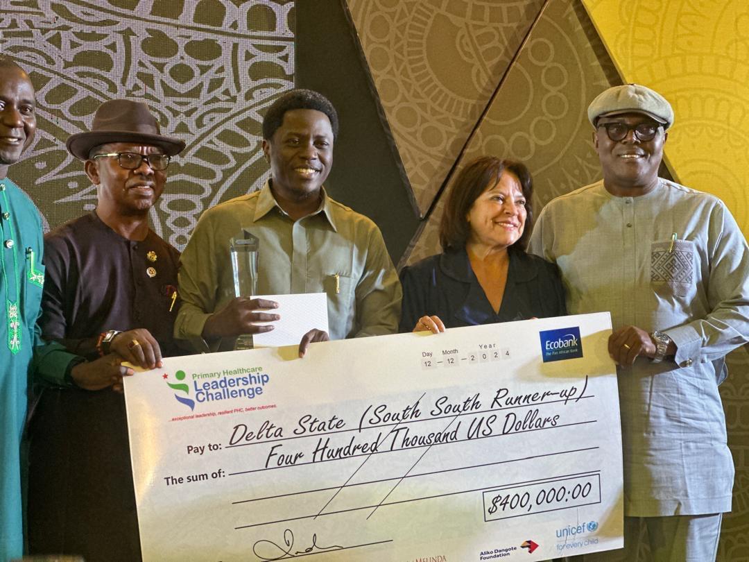 Delta State Commissioner for Health, Dr Joseph Onojaeme (middle), and the Director-General of the Delta State Contributory Health Commission (DSCHC), Dr Isaac Akpoveta (second left) receives Bill and Melinda Gates Foundation 400,000 Dollars Award for outstanding performance in Primary Health Care Management