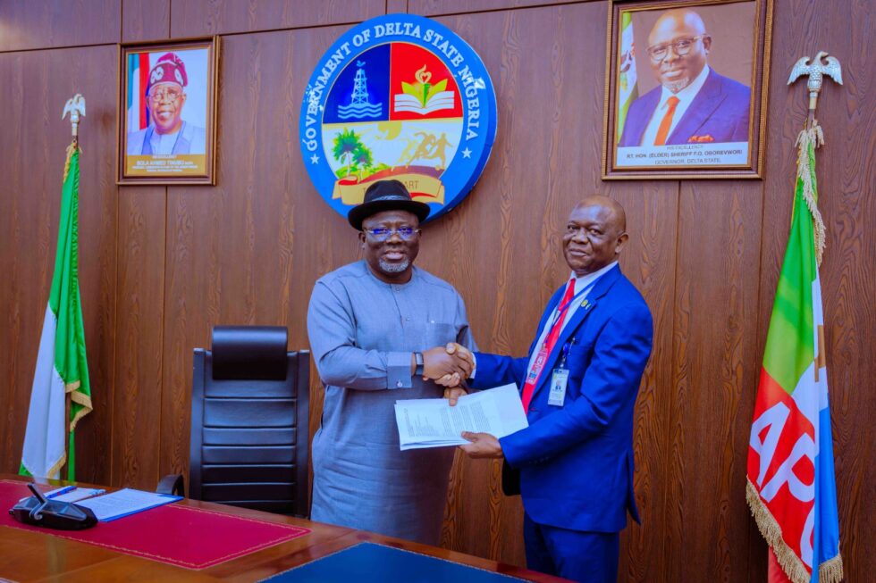 Delta State Governor, Rt. Hon. Sheriff Oborevwori (left), receiving a document from the Principal, Petroleum Training Institute (PTI), Effurun, Dr. Samuel Onoji during