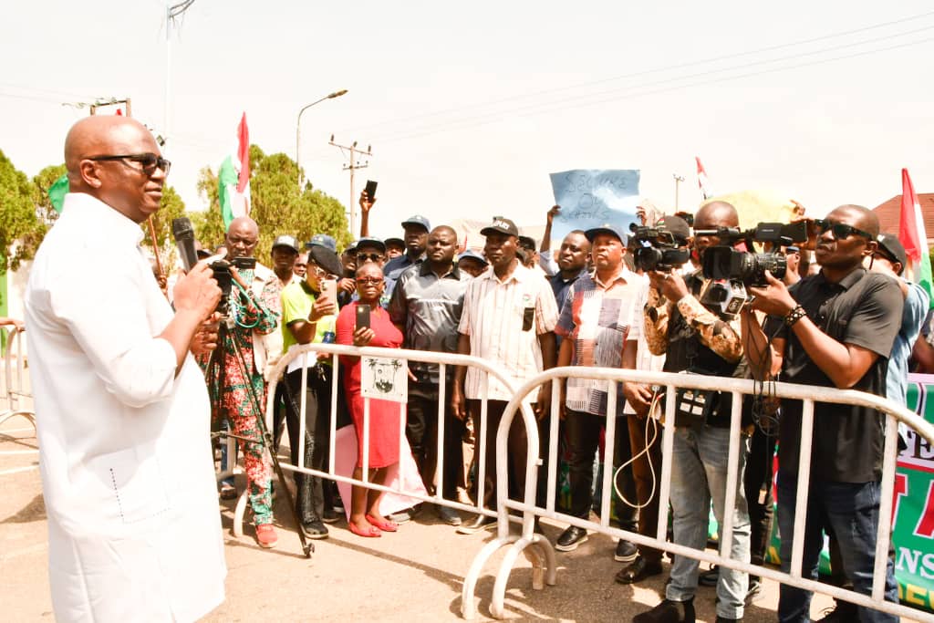 Chief of Staff, Government House, Hon. Johnson Erijo (left), addressing members of Delta State Chapter of the Nigeria Labour Congress (NLC) on behalf of Governor Sheriff Oborevwori, at the Government House Gate, Asaba, on Wednesday during a Nation-wide solidarity protest against insecurity in the Country.