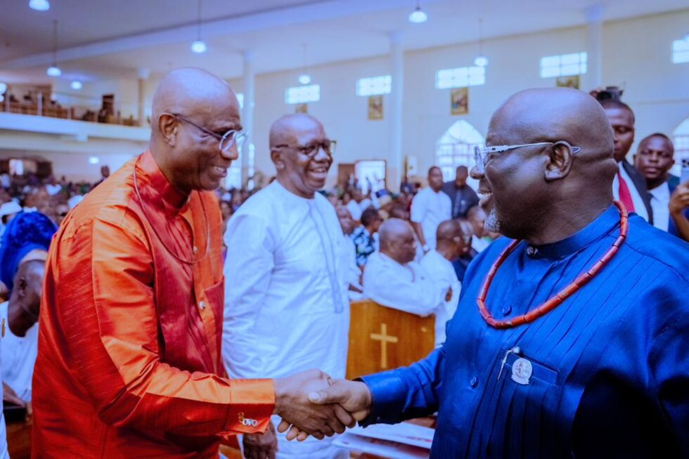 Governor Oborevwori greets Omo-Agege at Nwaoboshi Funeral as APC State Chairman, Chief Sobotie looks on.