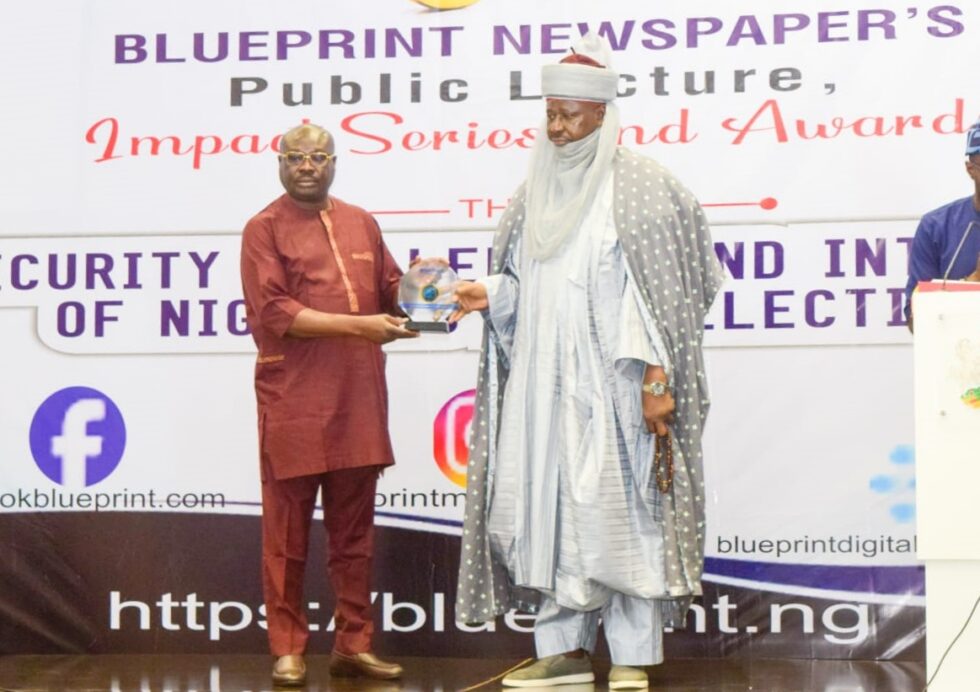 Representative of Etsu Nupe, Alhaji Yahaya Abubakar, Royal Father of the Day, Presenting the award to the Media Consultant to Tantita Security Services Limited, Dr. Paul Bebenimibo