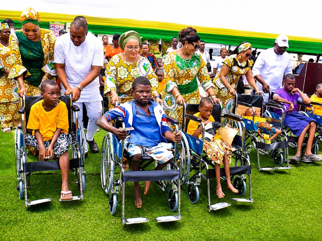 The wife of Delta State Governor and Founder, You Matter Charity Foundation, Deconess Tobore Oborevwori (3rd right); wheeling a child with special needs with keen interest supported by the wife of Deputy Governor, Ezinne Catherine Onyeme (3rd left) and other dignitaries during the Free Medical Outreach for children with special needs in Ika Federal Constituency held at Agbor on Tuesday, August 11, 2026