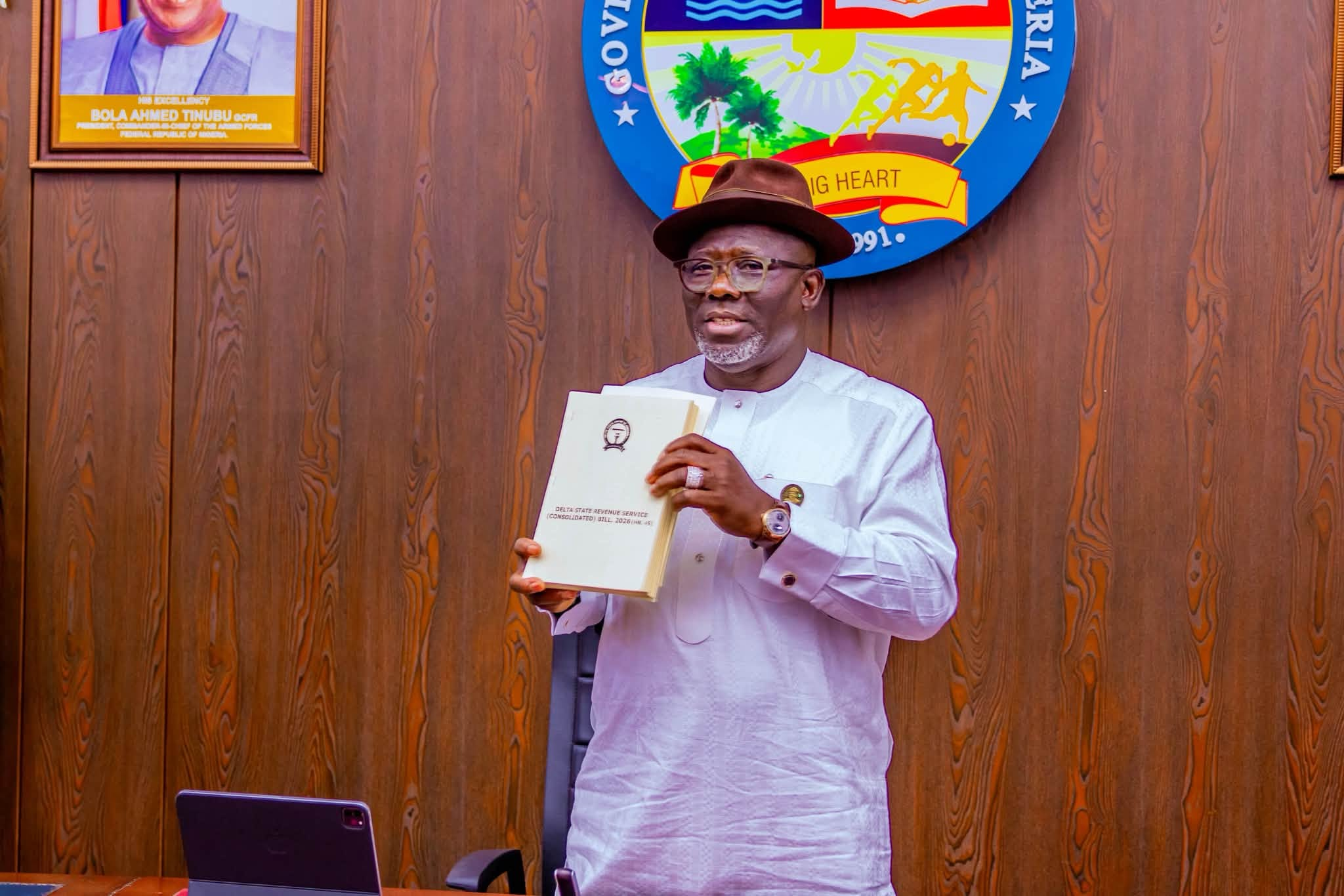 Delta State Governor, Sheriff Oborevwori, holds up the signed 13th-Month Salary Law after assenting it on Wednesday, October 28, 2026, at the EXCO Chamber, Government House Asaba.